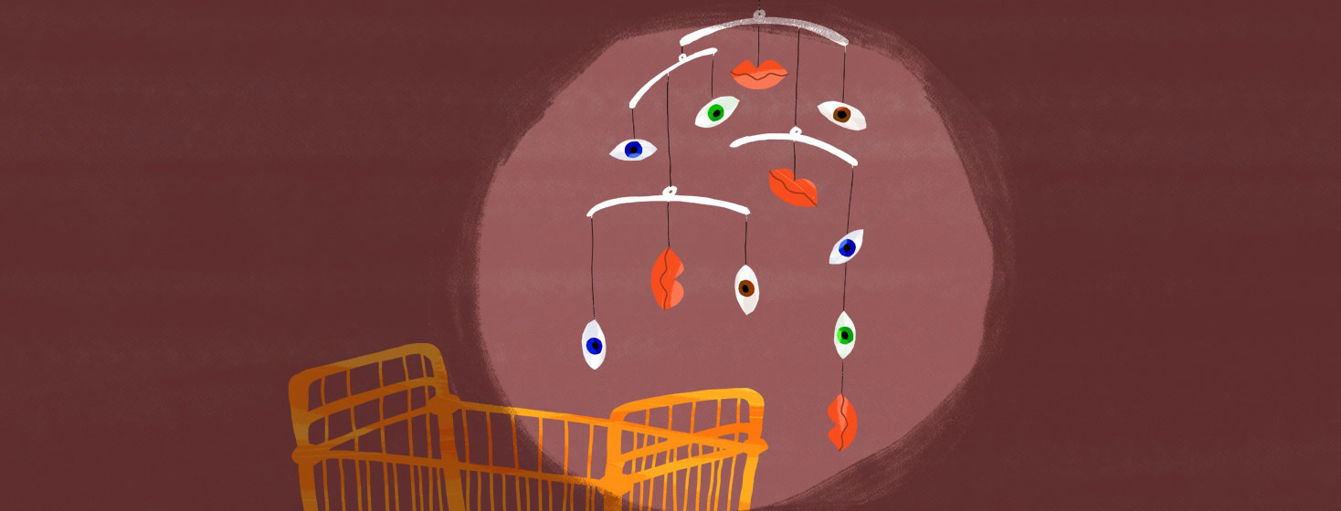 a crib with a baby mobile and the mobile has eyes and lips that are twisting and drooping