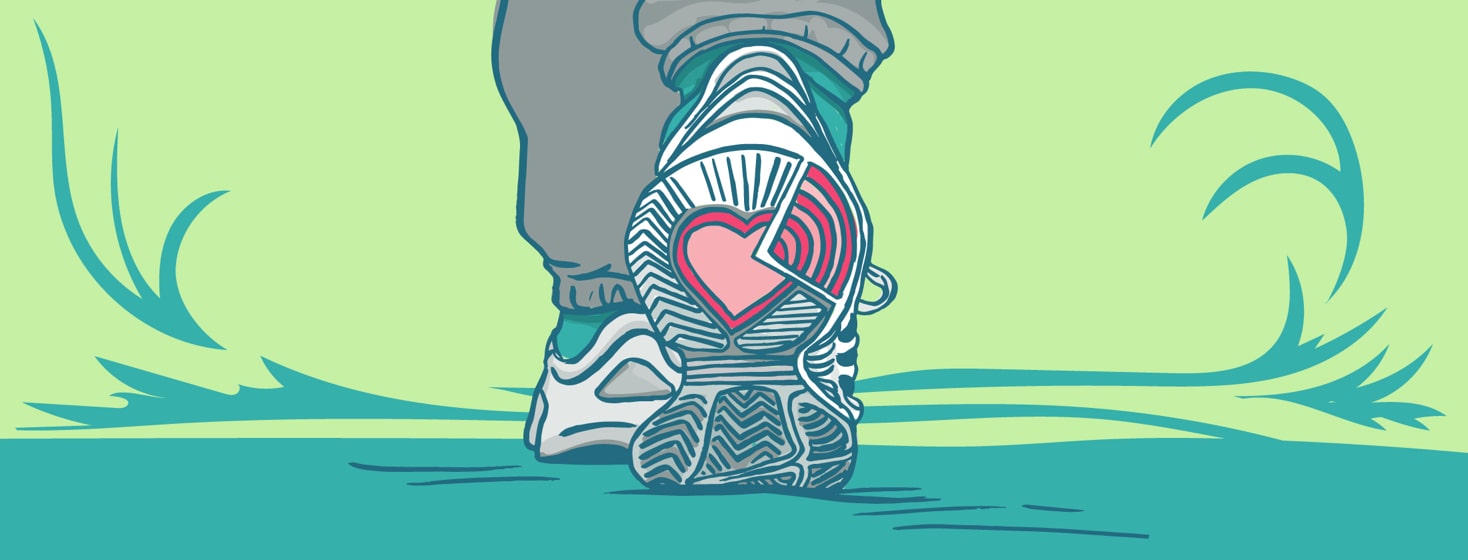Person walking with a heart on the sole of their shoe.