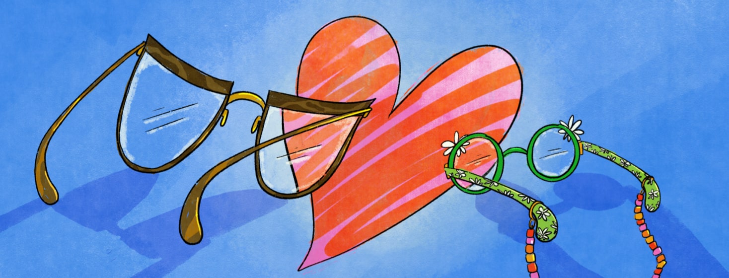 One adult sized glasses and one child sized glasses in front of a heart